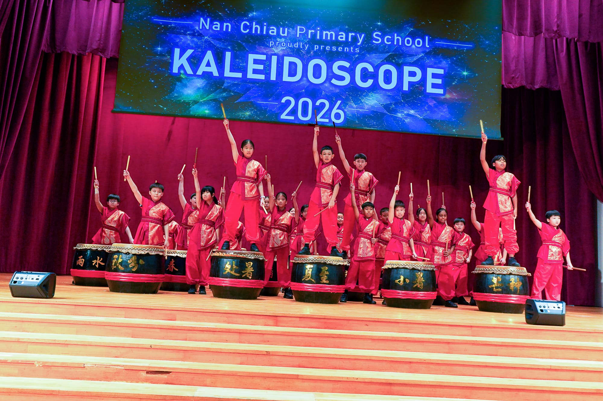 students performing on stage